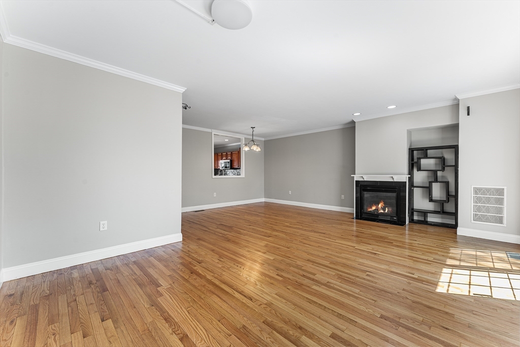60 Dodge Street, Unit 3 Beverly, MA 01915 - Photo 5 of 30 a view of empty room with wooden floor
