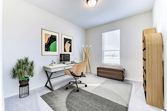 a workspace with furniture and a window