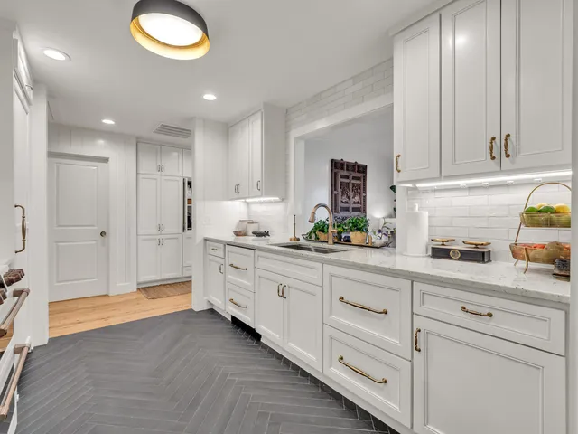 a kitchen with a table chairs and microwave
