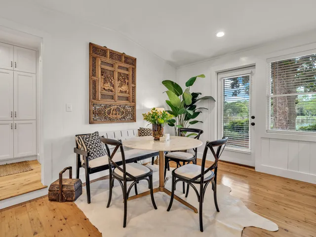 a spacious bedroom with a bed window and a mirror