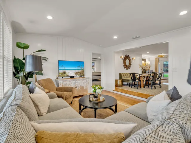 a living room with furniture and a rug