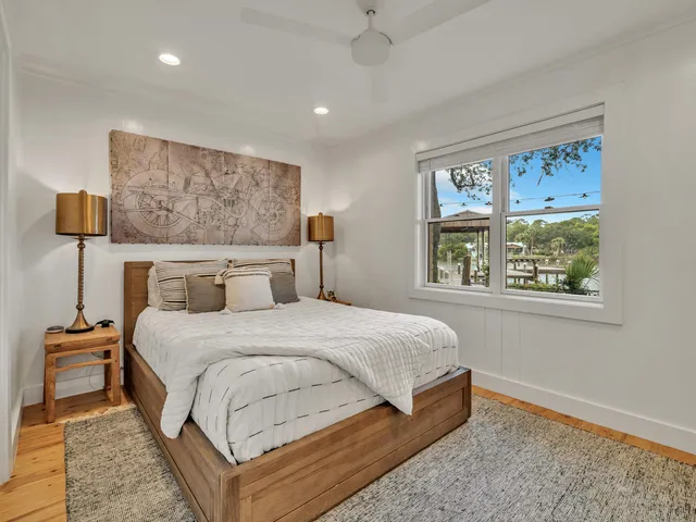 a view of a patio with a table and chairs and potted plants