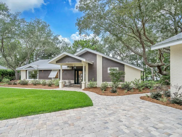 a view of a living room and dining room