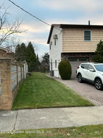 a view of a car parked in front of a house