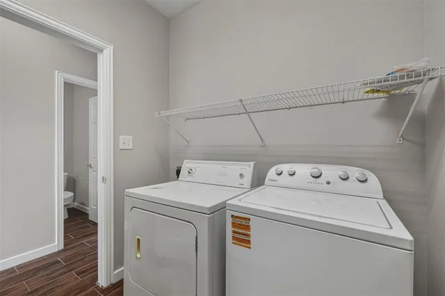 a view of storage and utility room with washer and dryer