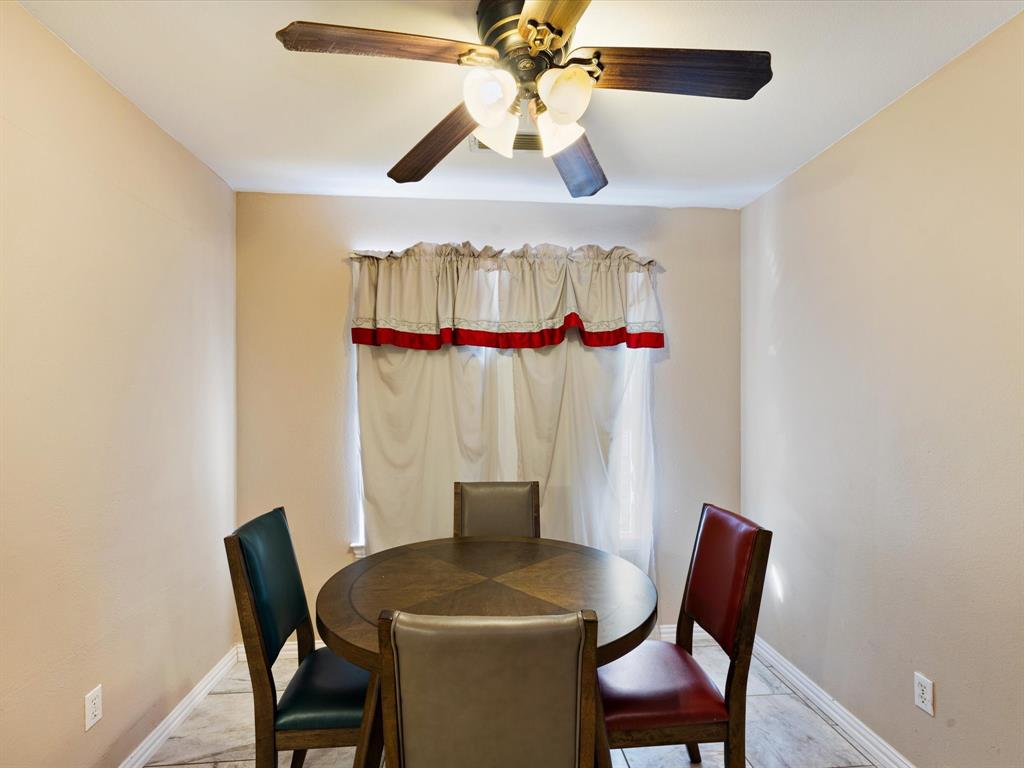 207 Quail Run Aubrey, TX 76227 - Photo 9 of 30 Dining space with ceiling fan and baseboards