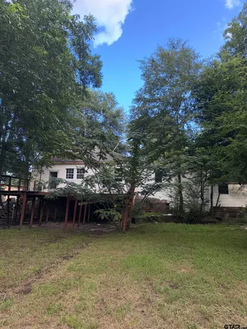 a view of a park with large trees