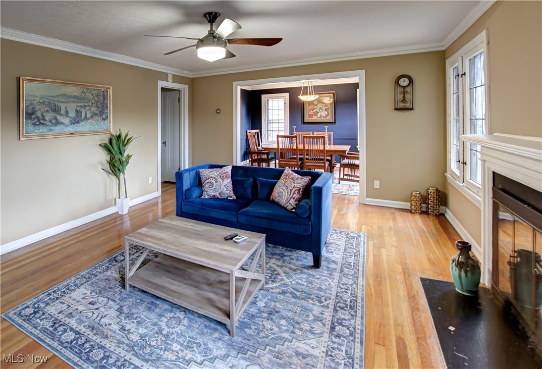 17800 Winslow Road Beachwood, OH 44122 - Photo 24 of 31 Living room featuring ceiling fan, ornamental molding, and hardwood / wood-style flooring