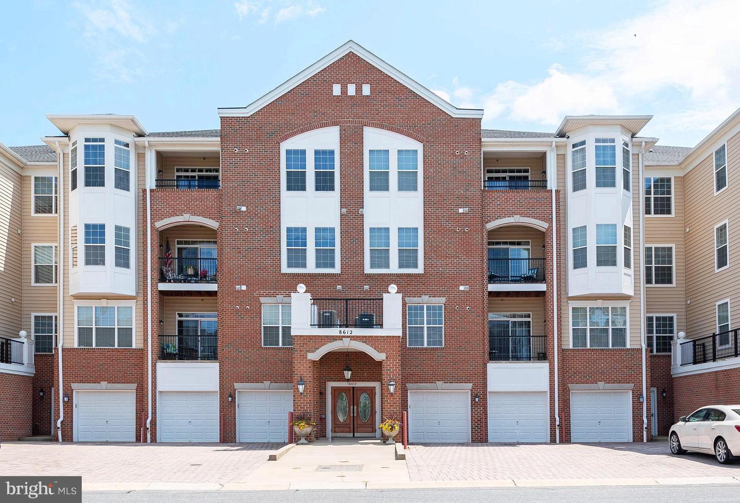 8612 Fluttering Leaf Trail, Unit 404 Odenton, MD 21113 - Photo 1 of 27 a front view of a multi story building
