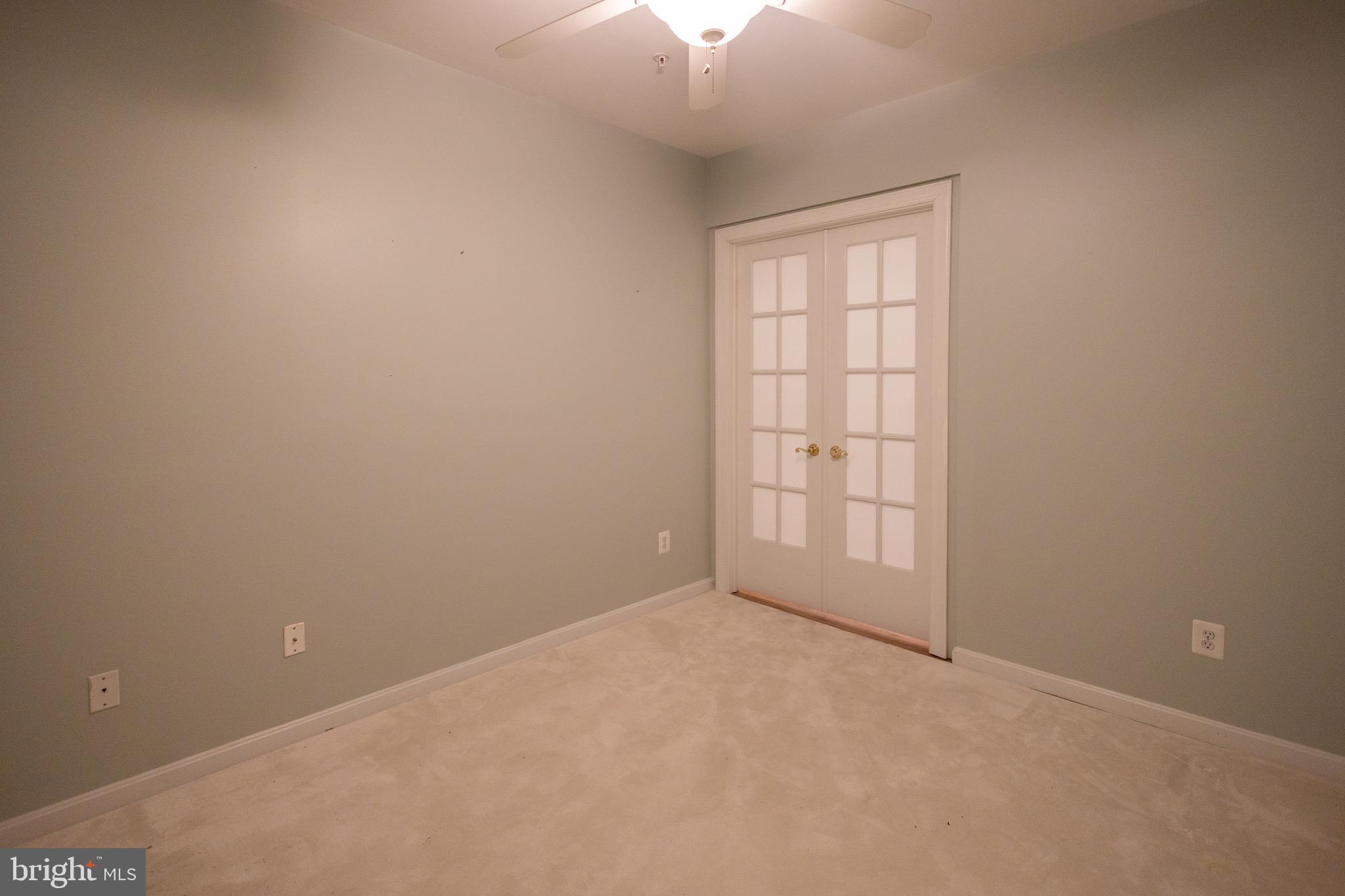 8612 Fluttering Leaf Trail, Unit 404 Odenton, MD 21113 - Photo 20 of 27 an empty room with a window