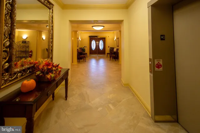 a hallway with kids room with couch