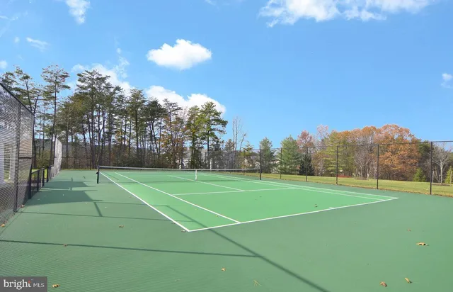 a view of an outdoor space and tennis court