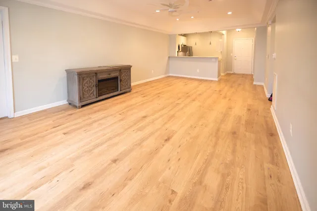 a view of an empty room with a fireplace