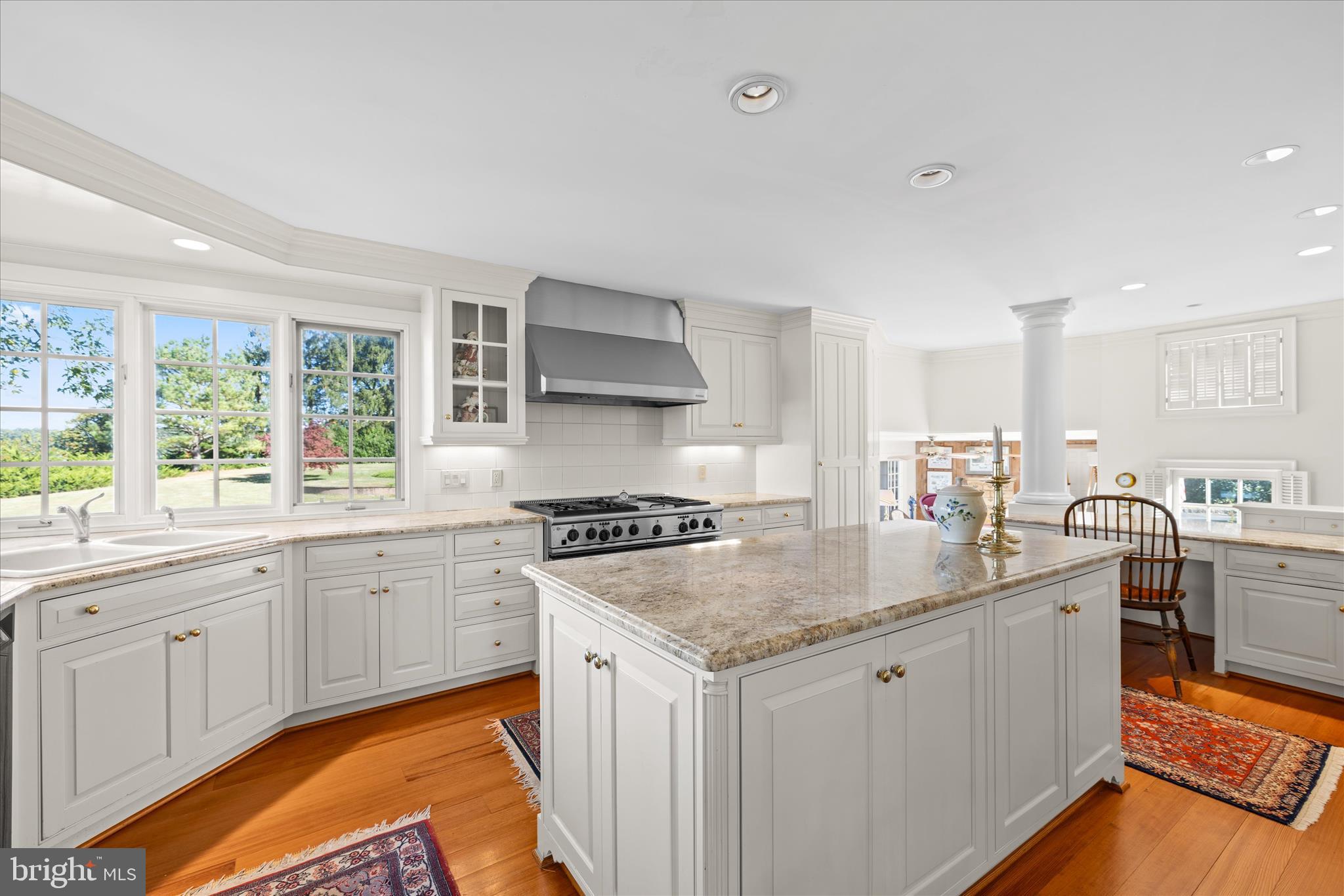 27473 Westpoint Road Easton, MD 21601 - Photo 16 of 58 a kitchen with granite countertop stainless steel appliances a sink stove and cabinets