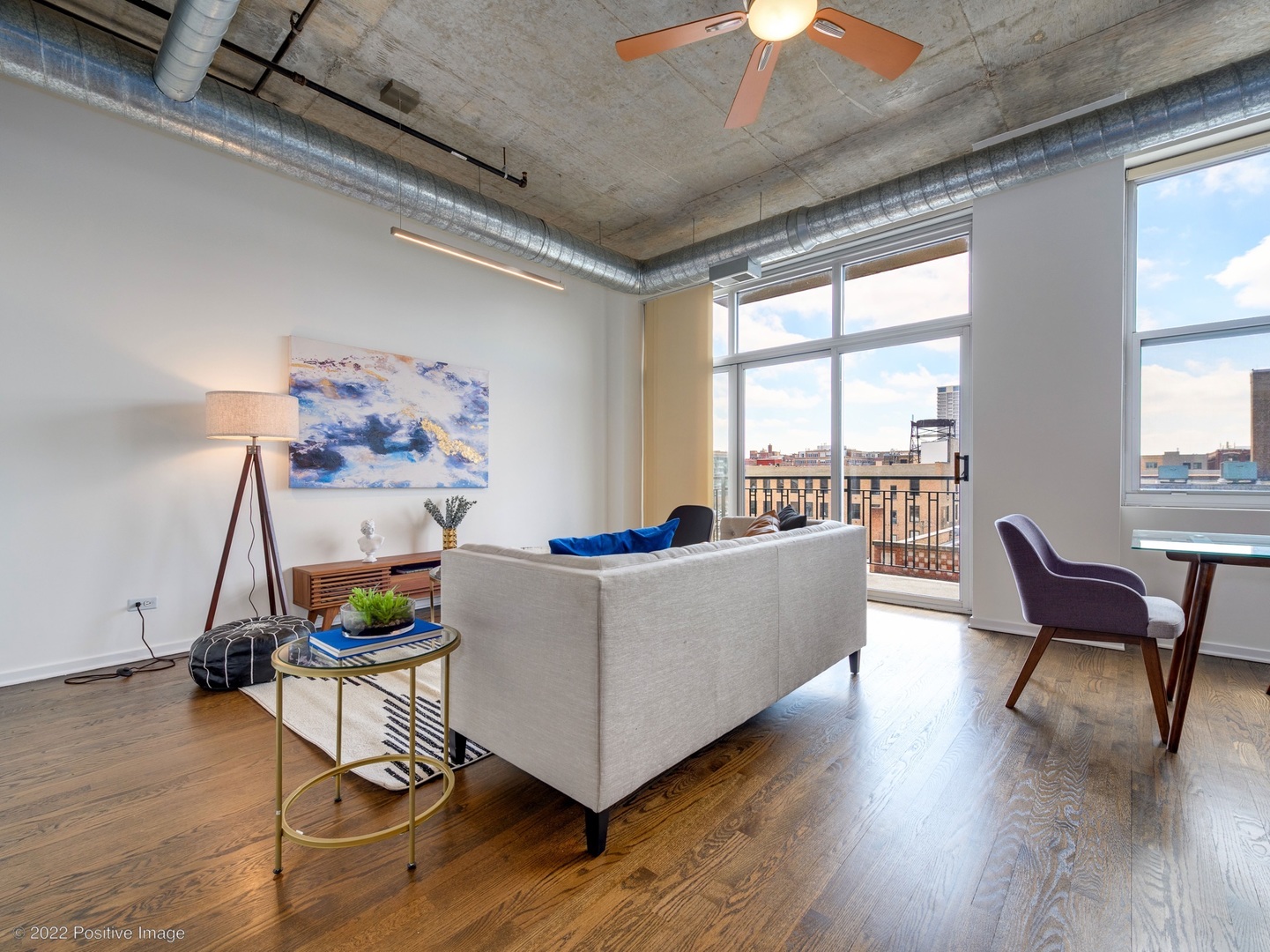 1000 West Adams Street, Unit 613 Chicago, IL 60607 - Photo 4 of 26 a living room with furniture and a wooden floor