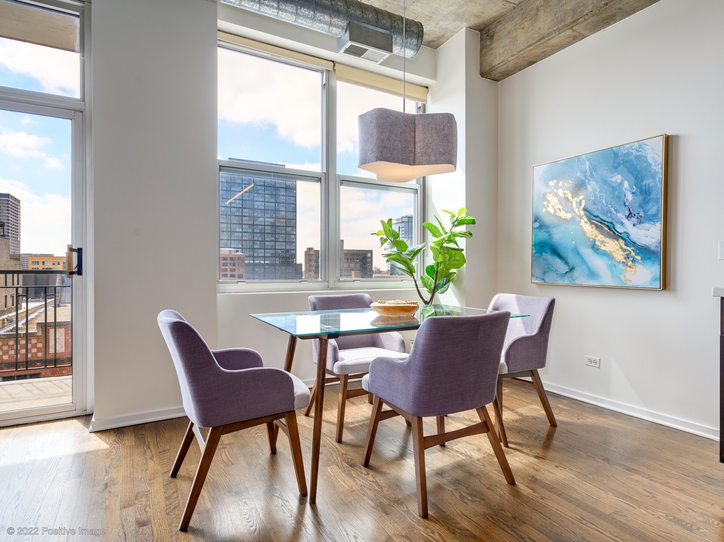 1000 West Adams Street, Unit 613 Chicago, IL 60607 - Photo 8 of 26 a view of a dining room with furniture window and wooden floor