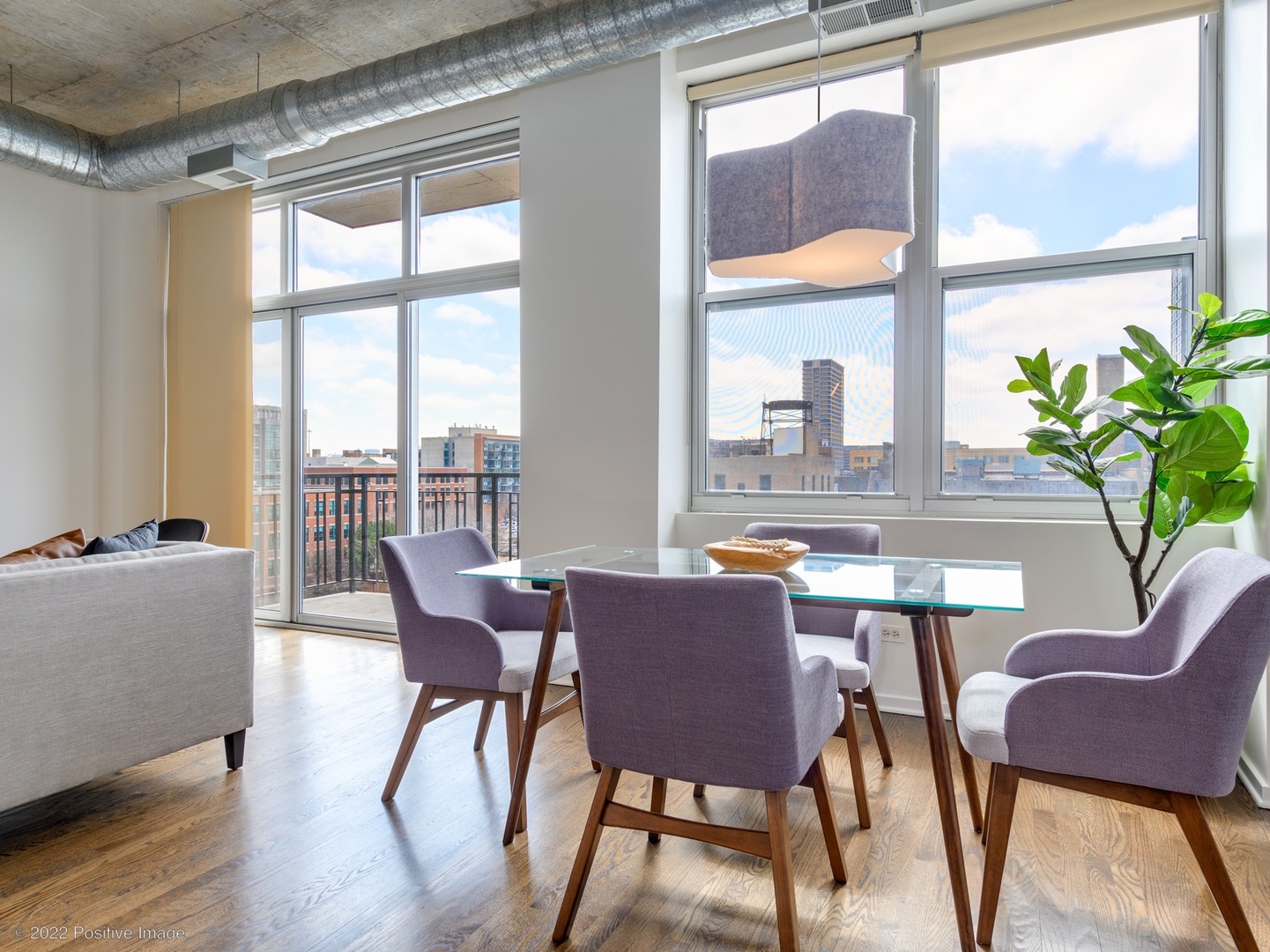 1000 West Adams Street, Unit 613 Chicago, IL 60607 - Photo 9 of 26 a dining room with furniture a chandelier and wooden floor