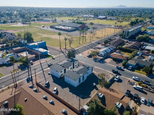 an aerial view of residential houses with outdoor space
