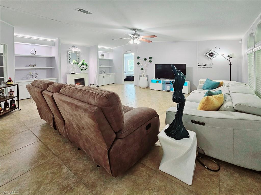 330 F Road LaBelle, FL 33935 - Photo 11 of 35 a living room with furniture and a flat screen tv