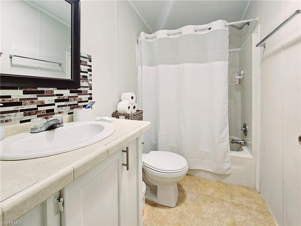 330 F Road LaBelle, FL 33935 - Photo 20 of 35 a bathroom with a sink toilet and shower