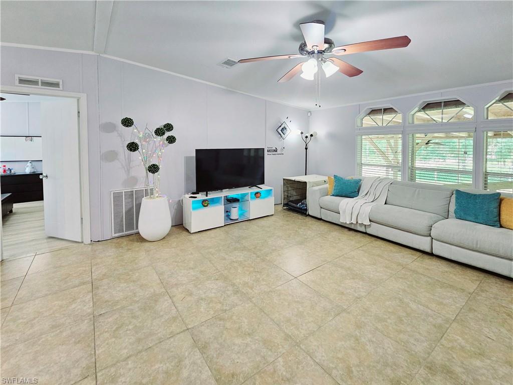 330 F Road LaBelle, FL 33935 - Photo 8 of 35 a living room with furniture and a flat screen tv