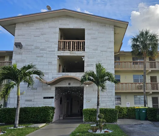 a front view of a house with yard