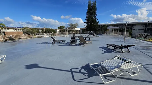 a view of a terrace with furniture