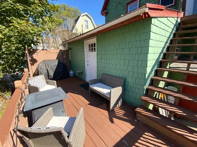 a backyard of a house with seating space