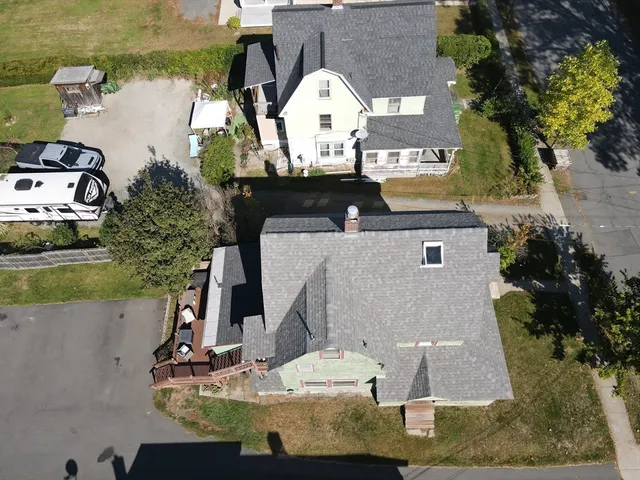 an aerial view of a house with lake view