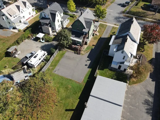 an aerial view of residential houses with outdoor space