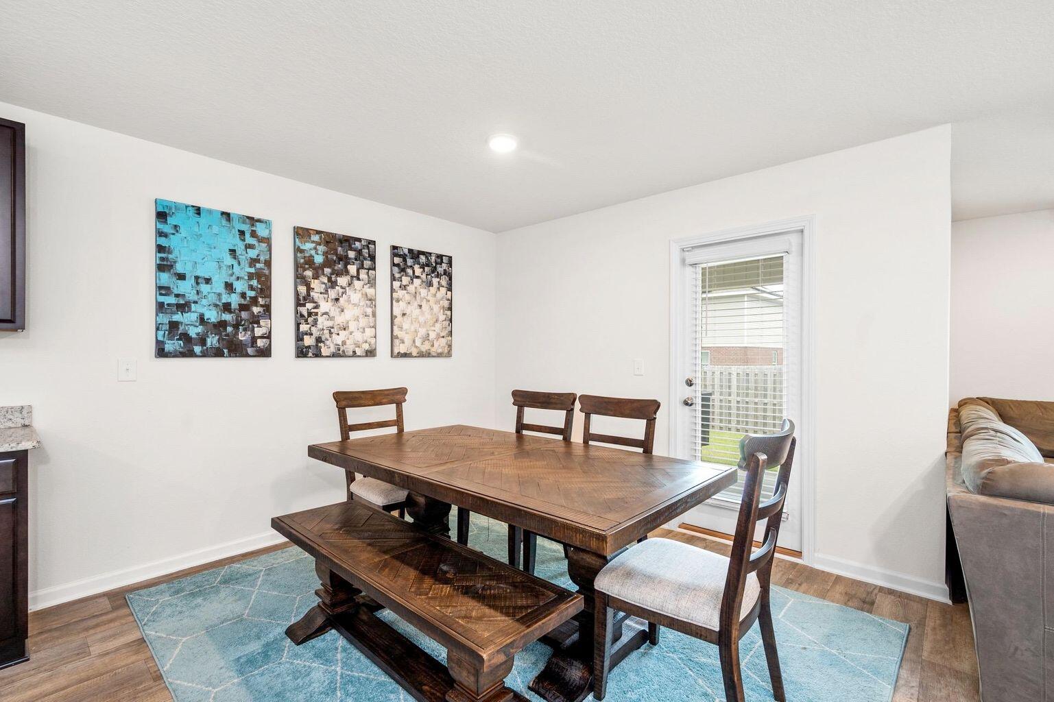 816 Moorhen Way Crestview, FL 32539 - Photo 13 of 19 a dining room with furniture and wooden floor