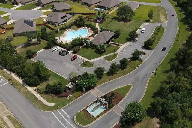 an aerial view of a house with outdoor space