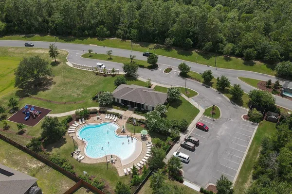 an aerial view of a house with outdoor space