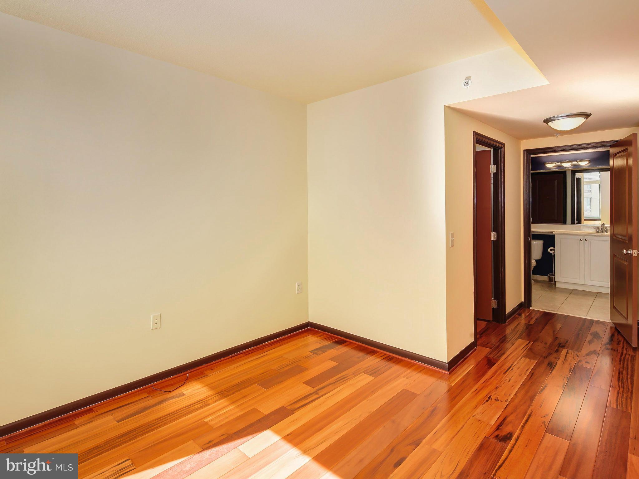 851 North Glebe Road, Unit 921 Arlington, VA 22203 - Photo 18 of 29 a view of a room with wooden floor