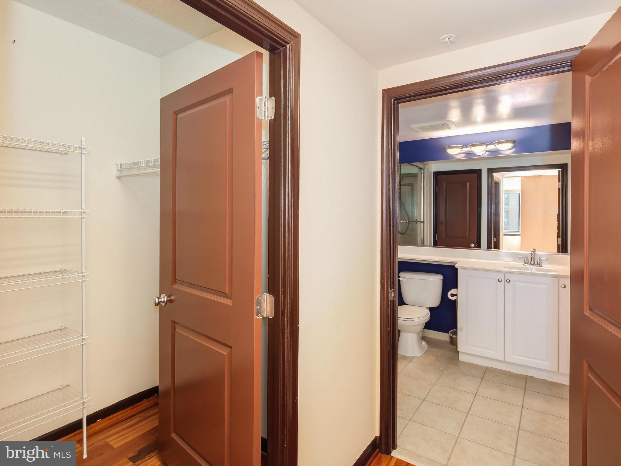 851 North Glebe Road, Unit 921 Arlington, VA 22203 - Photo 20 of 29 a view of a hallway and a room with a mirror
