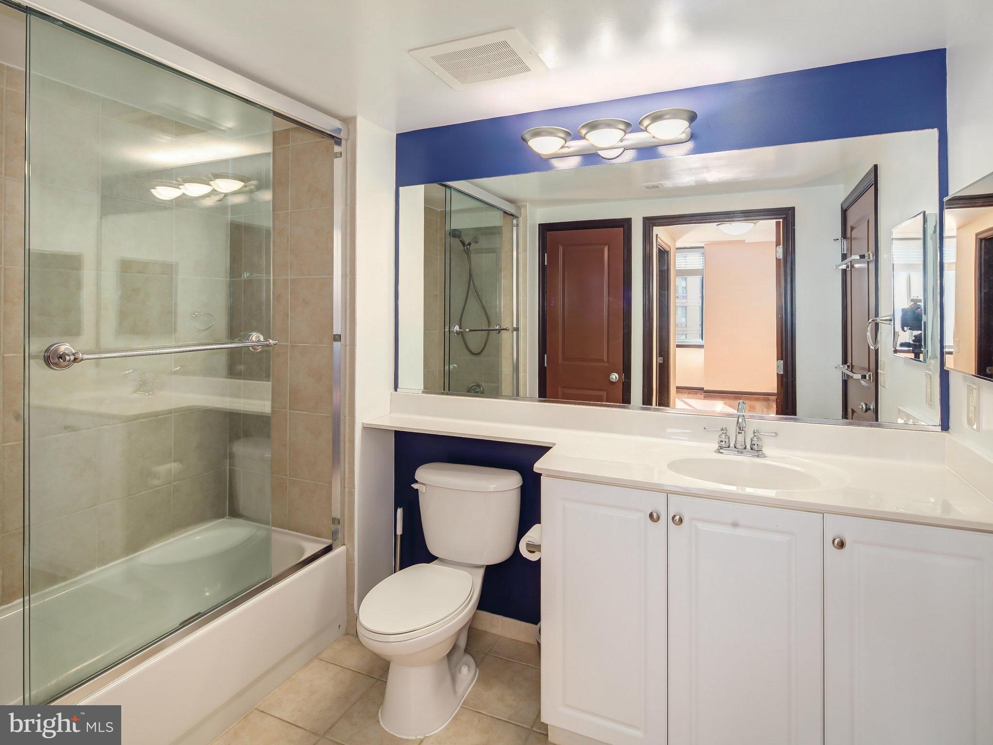851 North Glebe Road, Unit 921 Arlington, VA 22203 - Photo 21 of 29 a bathroom with a sink a toilet and shower