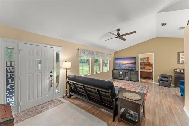 a living room with furniture and a table