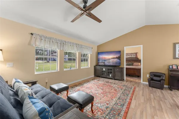 a living room with furniture and a rug