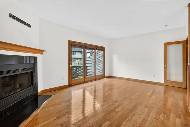 a view of an empty room and a window