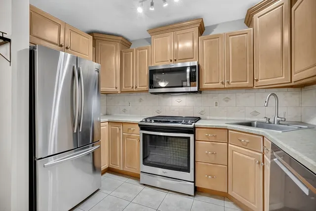a bathroom with a toilet a sink and a mirror