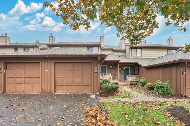a kitchen with stainless steel appliances a stove a sink a microwave a refrigerator and cabinets