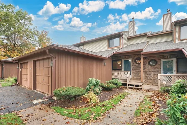 a view of staircase with railing and wooden floor