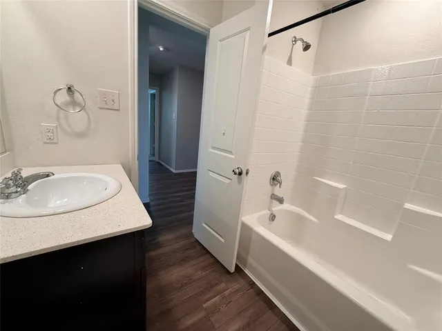 a bathroom with a sink and a bathtub