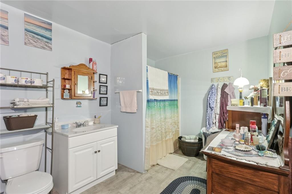 2753 Hemlock Lake Road Rossiter, PA 15772 - Photo 11 of 50 a bathroom with a granite countertop sink toilet and mirror