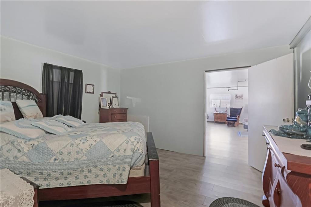 2753 Hemlock Lake Road Rossiter, PA 15772 - Photo 10 of 50 a bedroom with a bed and wooden floor