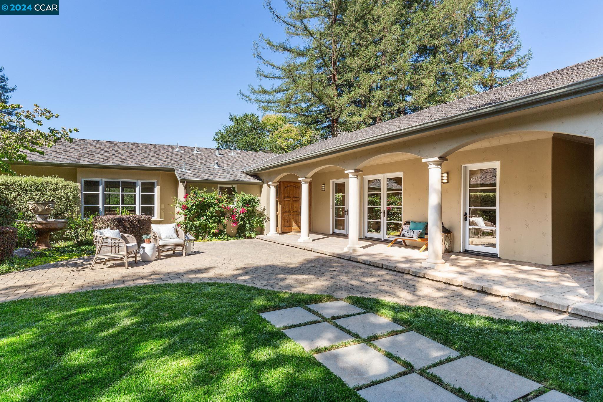 32 Crest Road Lafayette, CA 94549 - Photo 1 of 1 a view of a house with backyard sitting area and garden
