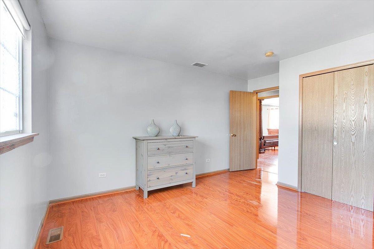 663 Primrose Lane Matteson, IL 60443 - Photo 15 of 32 a view of room with window and hardwood floor