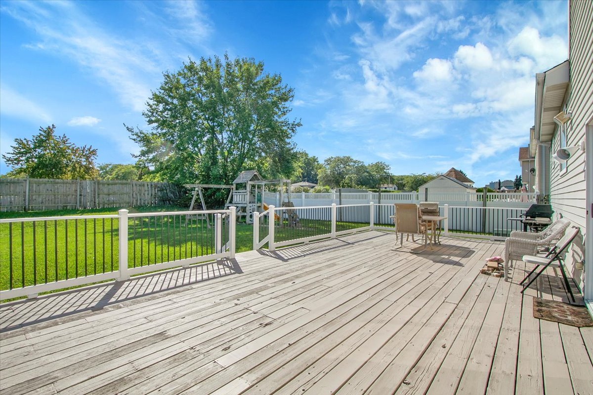 663 Primrose Lane Matteson, IL 60443 - Photo 30 of 32 a view of a house with a wooden deck