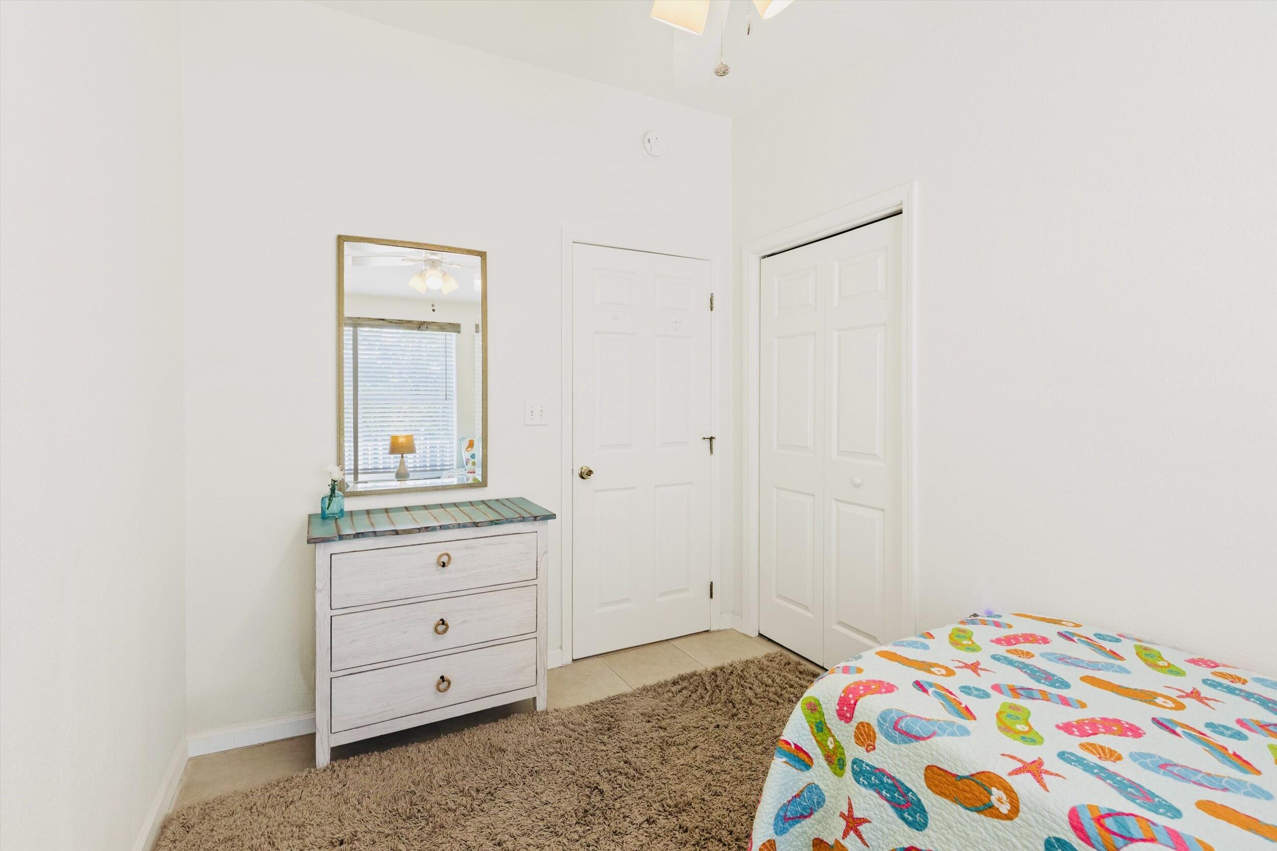157 Mars Lane Key West, FL 33040 - Photo 29 of 41 a bedroom with a bed and a dresser