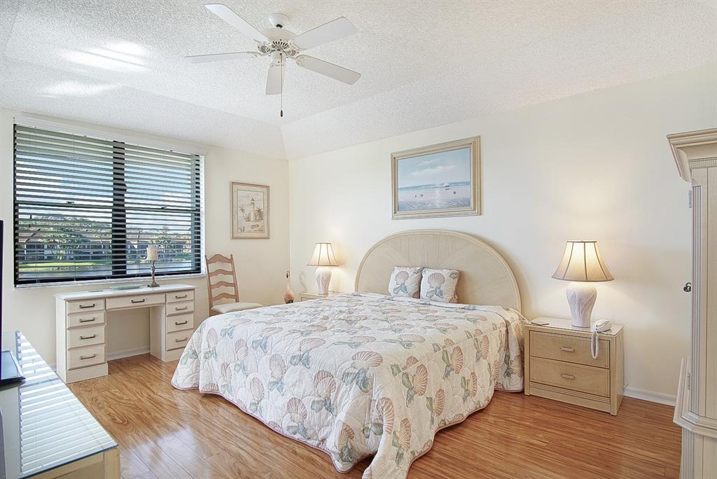 6081 Southeast Landing Way, Unit 9 Stuart, FL 34997 - Photo 11 of 31 a bedroom with a large bed and a window